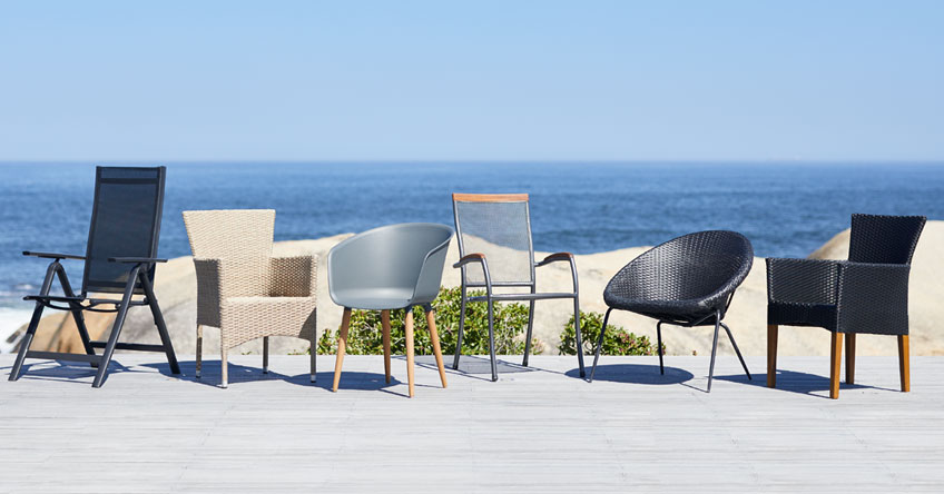 Dining chairs on patio by the beach Dining chairs on patio by the beach